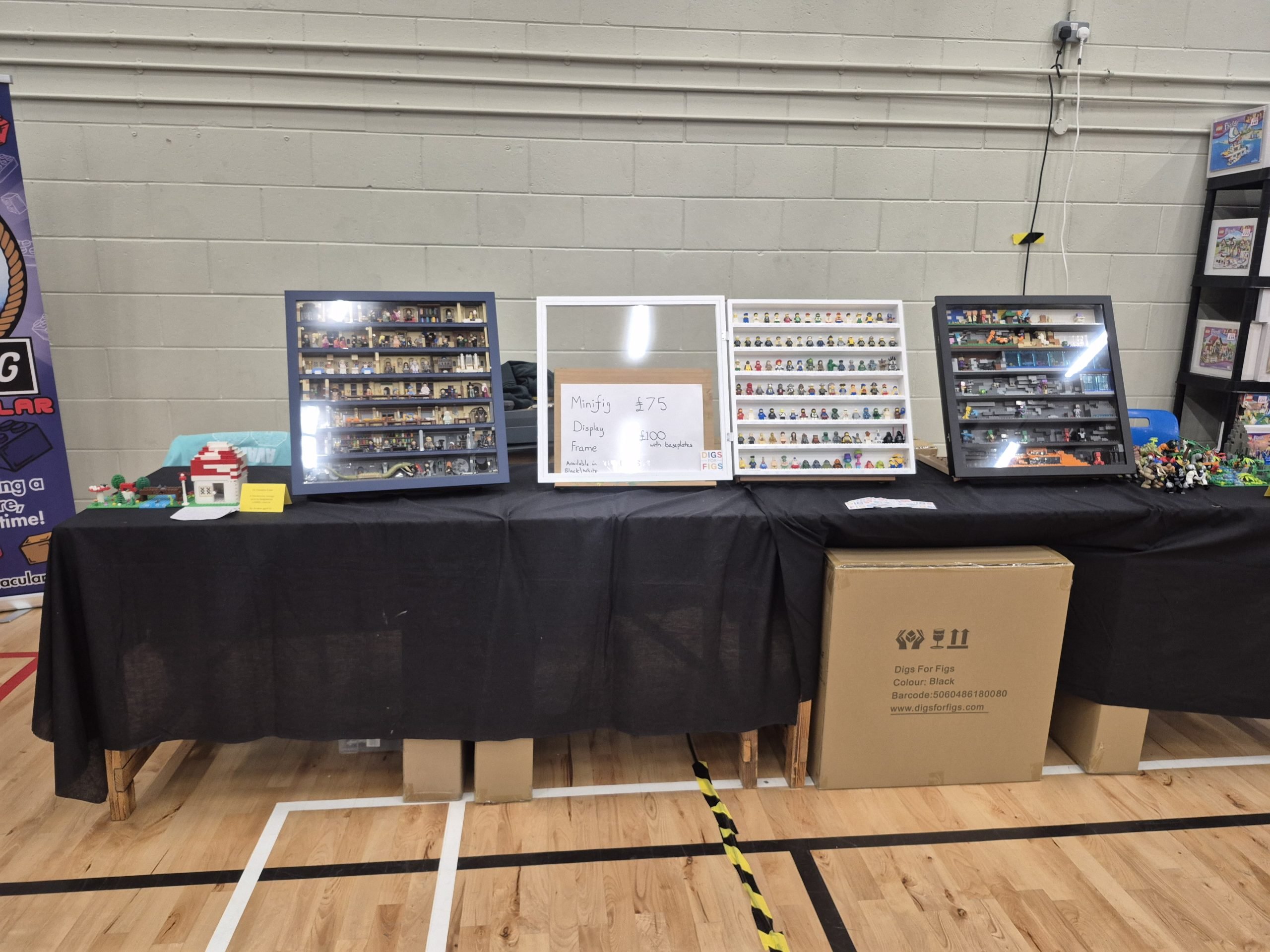 The Digs for Figs stand at Plymouth Bricktacular, with display frames of minifigures on a black-clothed table